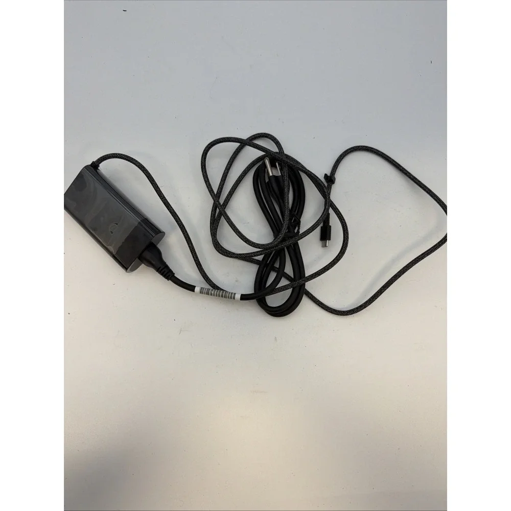genuine HP 65W USB-C AC adapter.